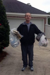 Robin Roberts picks up trash during his daily litter walk.