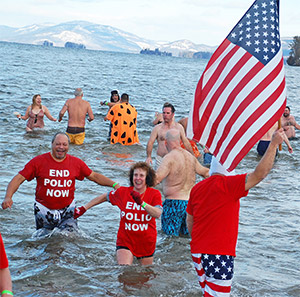 Rotary members in New York jump into the icy waters of Lake George to raise money for polio eradication in January. Photo courtesy Harriet Noble